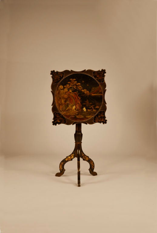 Chinoiserie lacquer decorated tilt-top candle stand with overall black lacquer and 