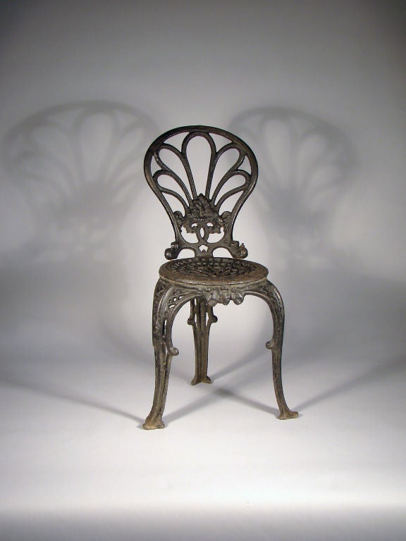 Rare English Coalbrookdale 3-leg cast iron garden chair.<br />
<br />
Reference: 'Cast Iron Funiture' by Georg Himmelheber (Cover illustration - made by Coalbrookdale 1847) Wonderful example! Never had a wire stretcher like the one on the cover of