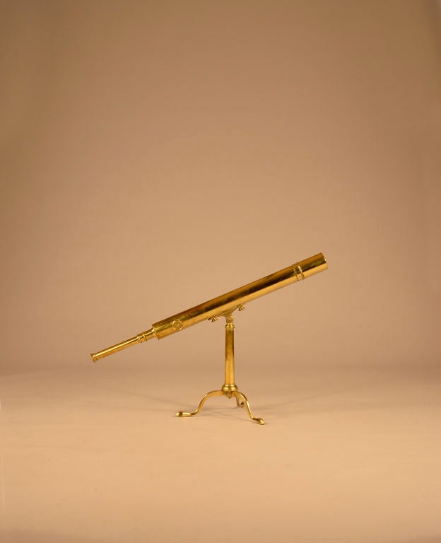 A superb English brass refracting telescope with original tripod stand, all in good working condition.<br />
<br />
When zeroed in it focuses quite well with very little distortion.