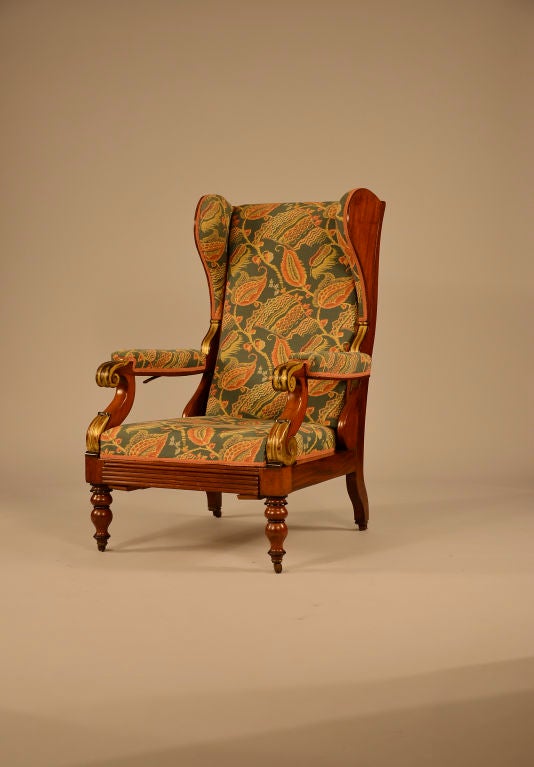 Superb William IV Metamorphic armchair with gilded scrolled arm supports.<br />
<br />
This remarkable chair is winged (for comfort) and will recline to almost flat (with a mechanical lever under the right arm).  What appears to be the front