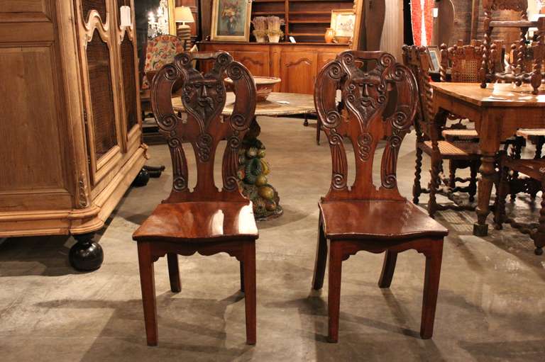 English Pair Of Jacobean Hall Chairs With Shaped Seats, Tapered Legs, Pierced Carved Back For Sale