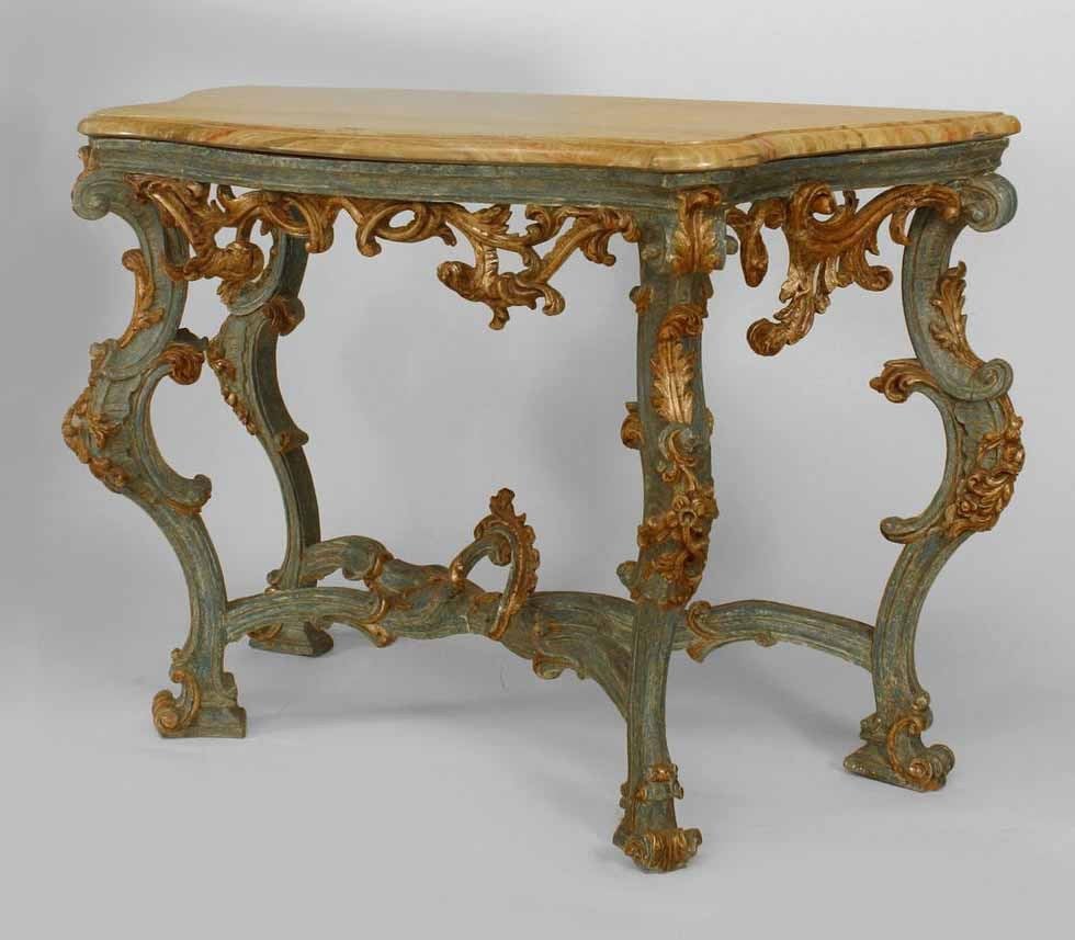Pair of Italian Roccoco Blue Painted and Silver Gilt Trimmed Carved Console Tables with Stretcher and marble Top with Faux Sienna Finish.