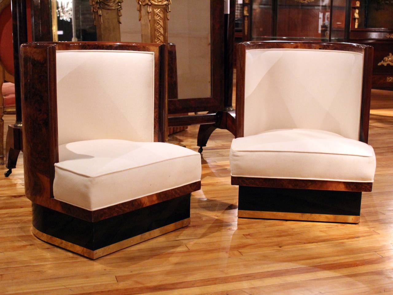 Pair of Italian slipper chairs in burl wood with shaped back, cushion seat and brass trim.