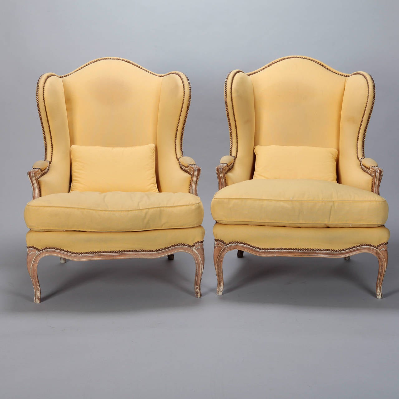 French Pair High Back Winged Bergeres With Matching Stools