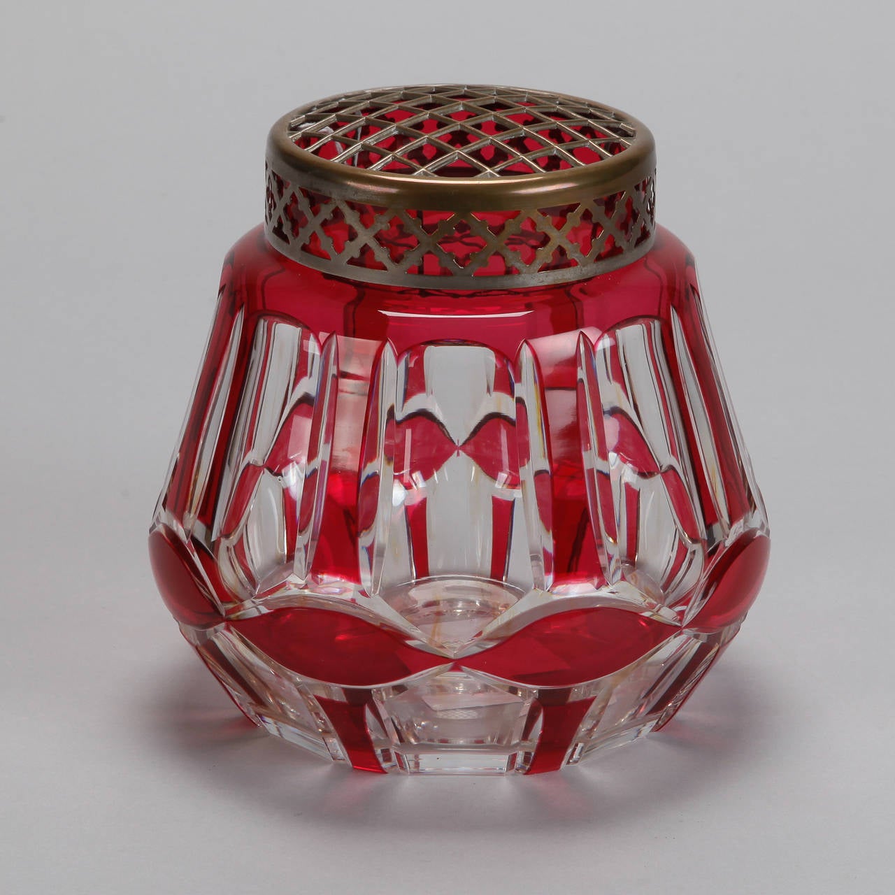Circa 1900 ruby red and clear cut glass rose bowl by Belgian manufacturer Val Saint Lambert topped with brass flower frog.