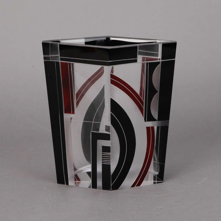 Circa 1930s large four sided, diamond shaped Art Deco vase in clear faceted glass with black and red geometric enamel designs.
