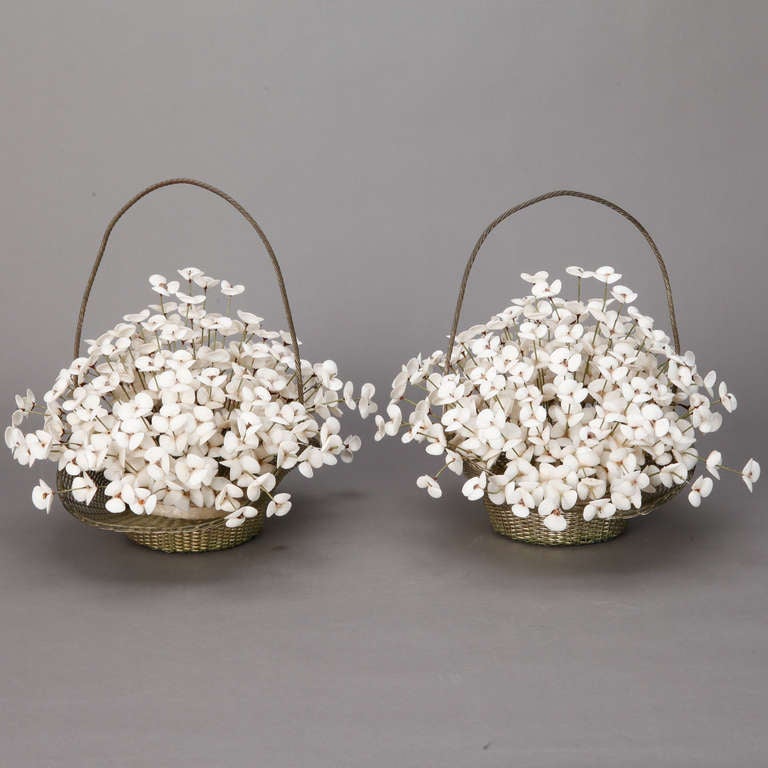 French woven metal basket with flowers made of wire and white shells, circa 1920s. Two baskets of shell flowers sold and priced separately.