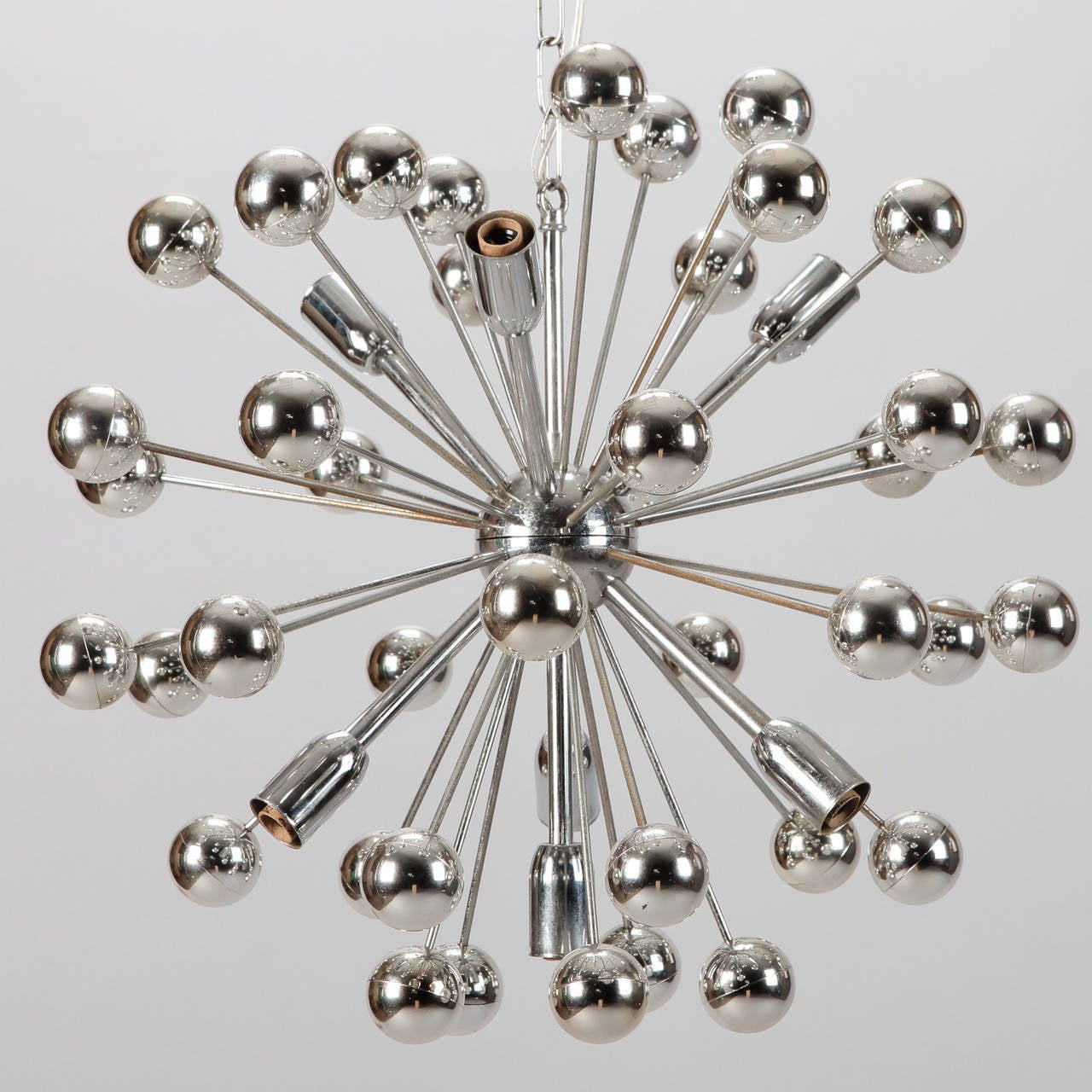 Circa 1960s chrome Sputnik style light fixture in atomic star burst shape with chrome ball ends and twelve light sockets.