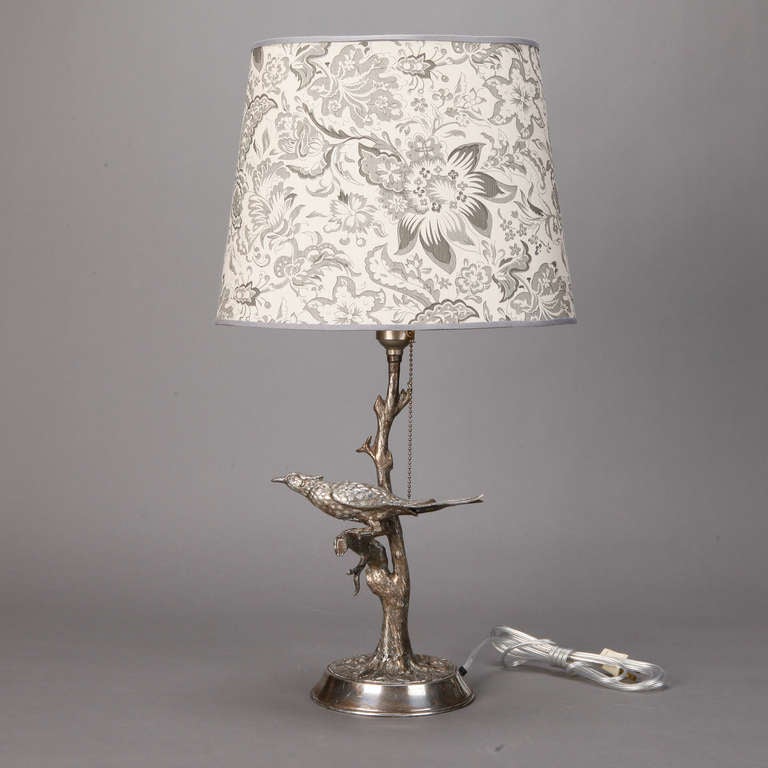 Circa 1940s silver plated table lamp with tree form center support and sculpted bird. New wiring for US electrical standards. Shade shown is not included but available for sale. Please inquire.