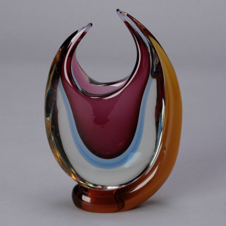 Circa 1960s Flavio Poli Murano glass sommerso oval vase with asymmetric, pulled rim in stunning shades of amethyst, blue and amber. We also have a Flavio Poli center bowl in similar colors and style. Please inquire.