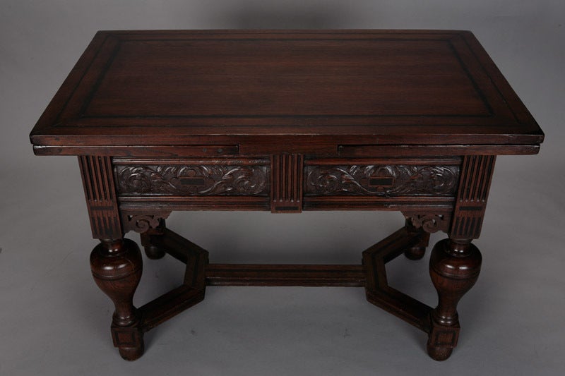 19th century English oak draw leaf table extends to 82” when leaves are extended. Width/length is 45.5