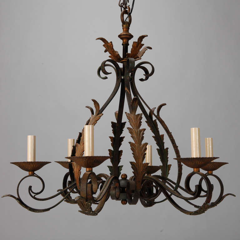 Circa 1920s Italian iron chandelier with a green, leaf-form frame and gilded accents. Six candle style lights. New wiring for US electrical standards.