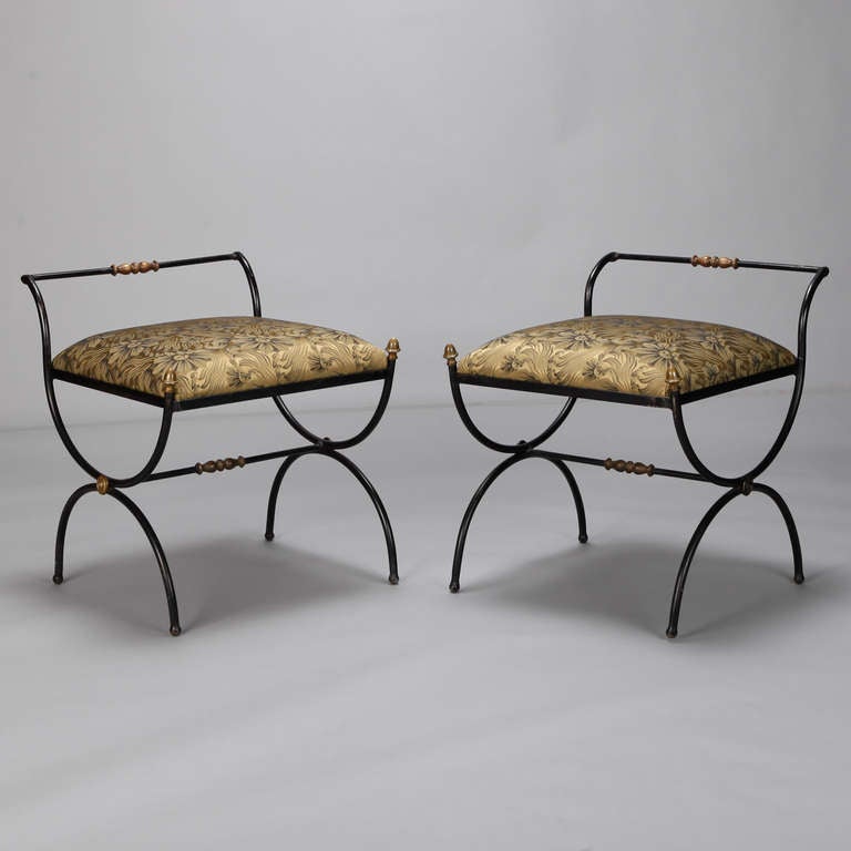 This pair of circa 1960s French neoclassical style stools have iron frames with gilded accents and newly upholstered seats covered in a luxe dark gold damask fabric. Seats are 19.75