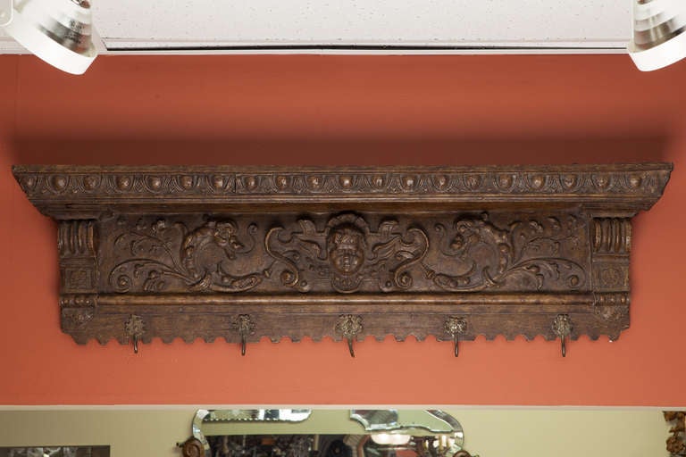119th Century Dutch Carved Shelf with Cherub and Brass Coat Hooks
