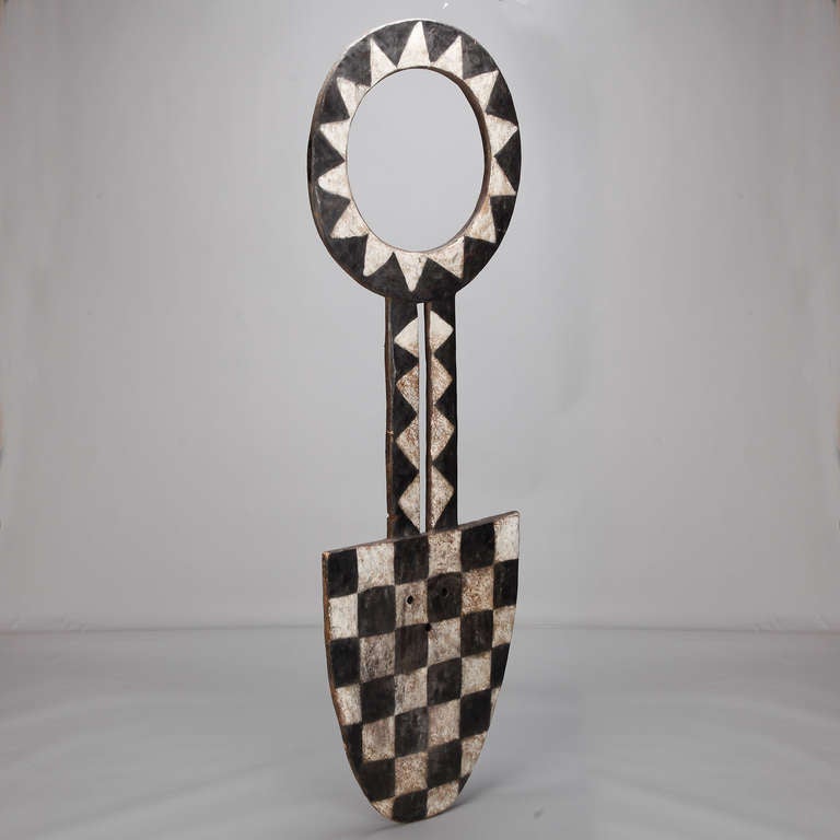 Circa 1980s wood Bobo fertility mask from Cameroon with bold black and white graphic finish.