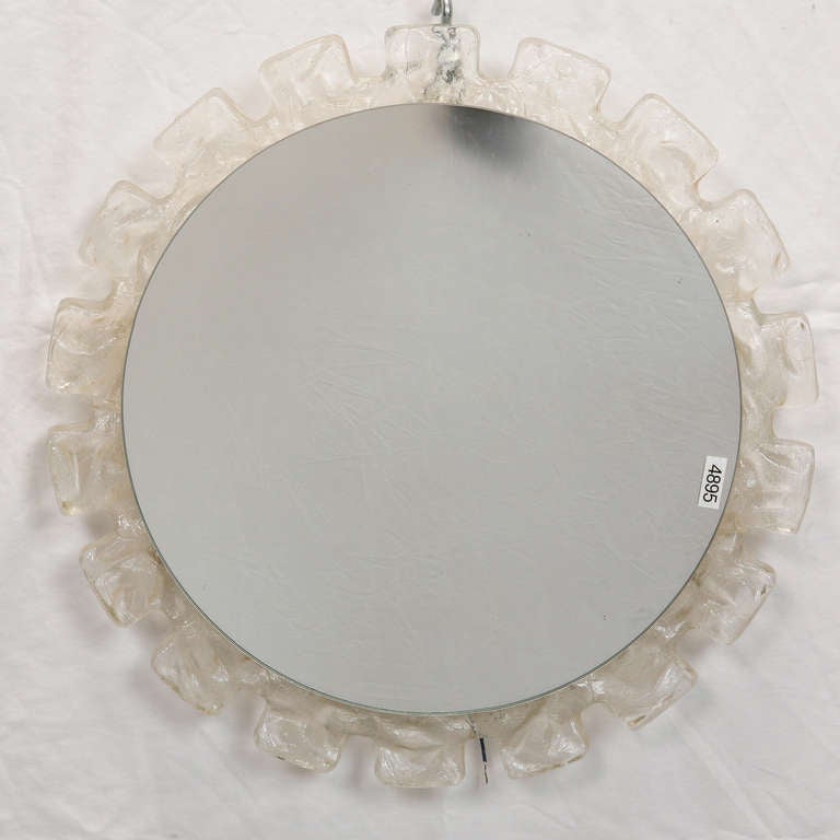 Circa 1970s round mirror with light up, clear ice-style acrylic frame with battlement style patterned edge. New wiring for US electrical standards. 