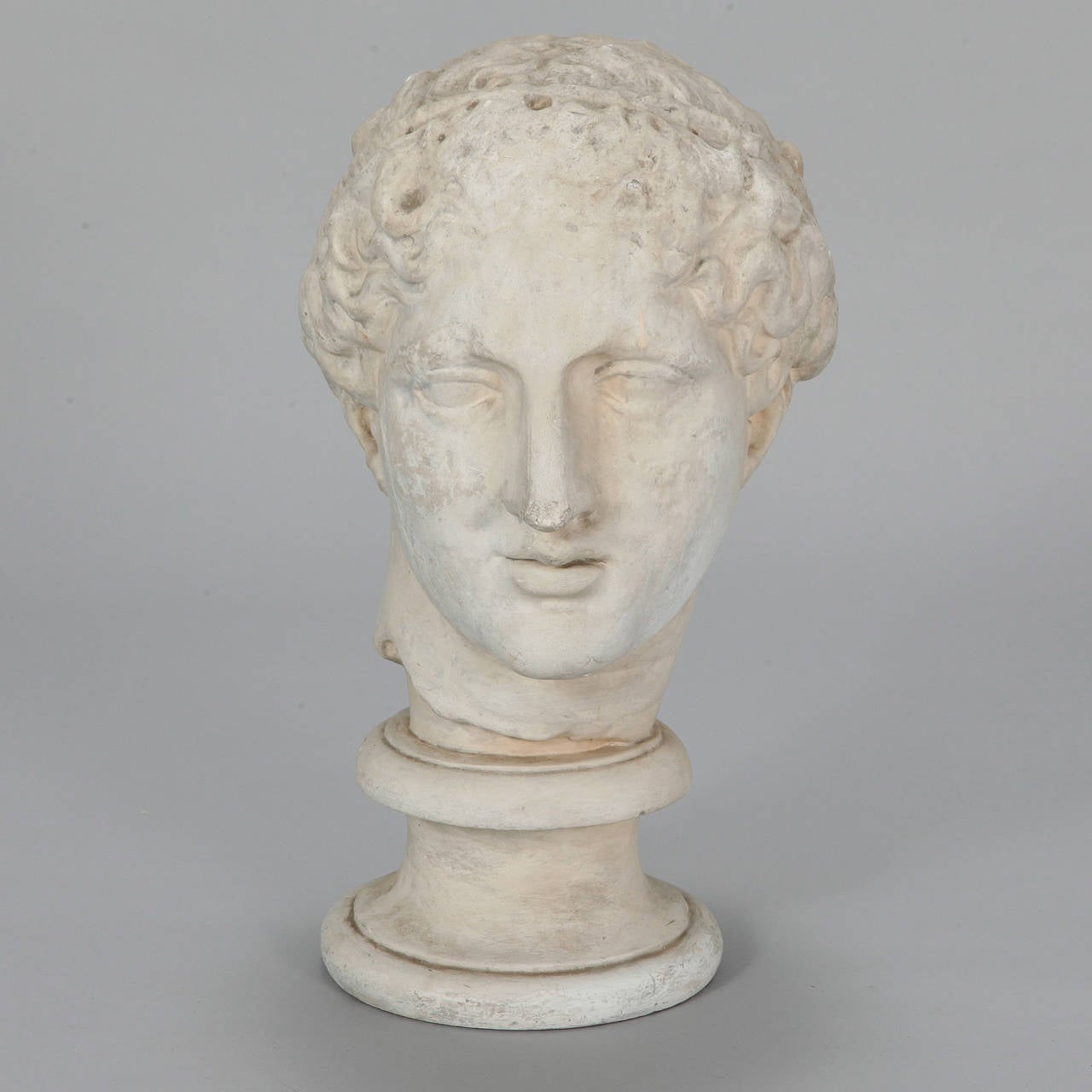 Circa 1960s classic plaster bust of a young Julius Caeser with attached base / stand.