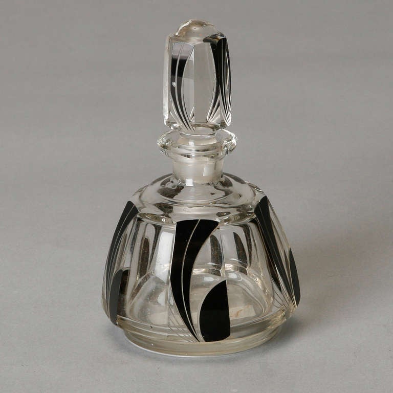 Art Deco era Bohemian art glass perfume bottle of clear faceted glass with abstract black swirl design. We have additional pieces from this series. Please inquire. 