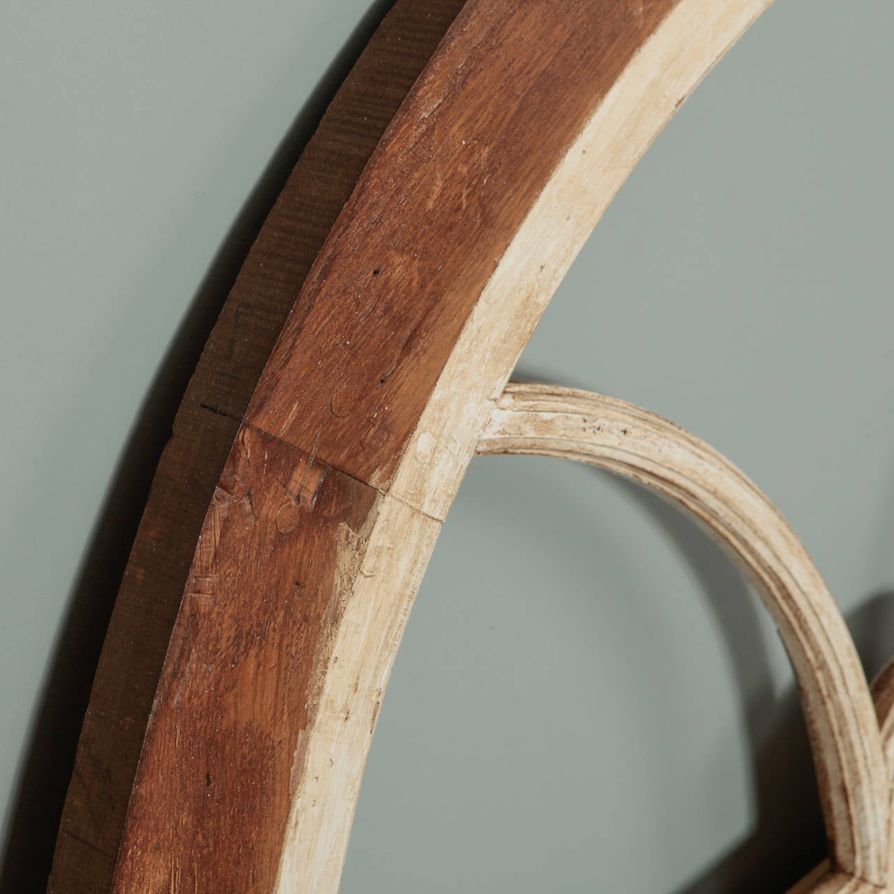 Circa 1910 French arched window frame with white painted finish and bare wood outer edge. Great size and shape; Use as is to decorate a wall or add a mirror. Multiple frames available. Priced and sold individually.