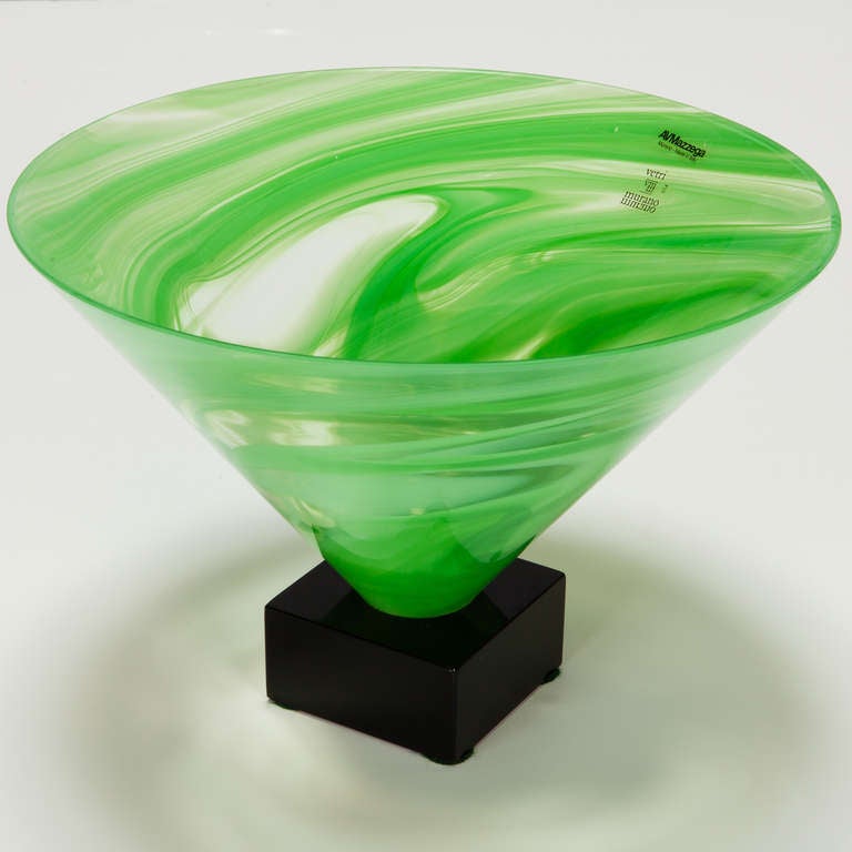 Murano glass deep cone shaped vase with bright, spring green marbled glass. Mounted on a black wood base. Original label AV Mazzega label affixed, circa 1980s.