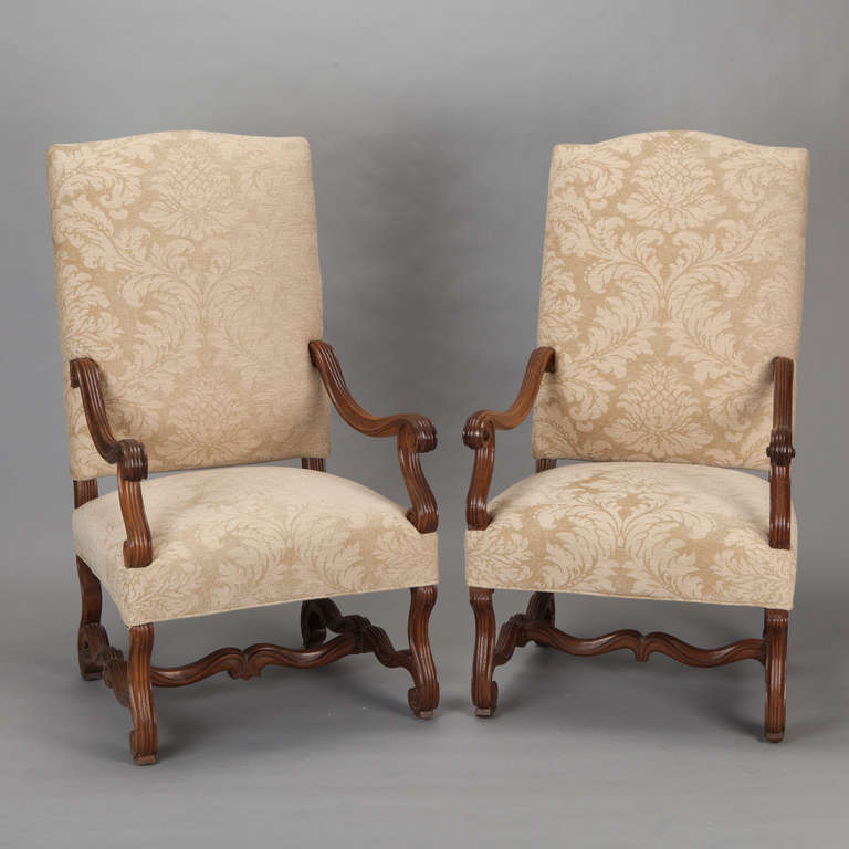 Pair of circa 1920s large French os du mouton style armchairs have curvy scrolled arms, legs and stretchers. Newly upholstered in a neutral ivory and beige chenille jacquard. Sold and priced as a pair.

Arm Height:  23” to 25” 
Seat height: 