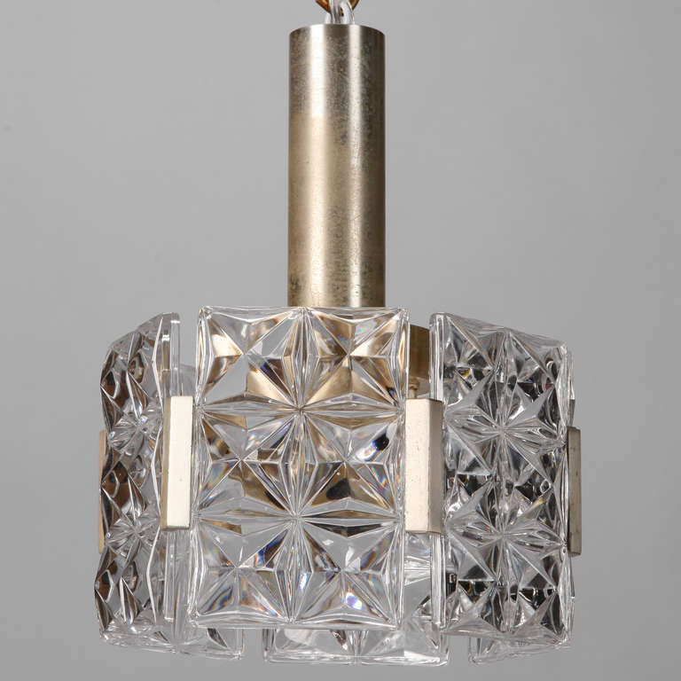 Mid century small hanging crystal pendant fixture attributed to Kinkeldy. Single internal socket, brass plated finish has some fading. New electrical wiring for US standards. 
e