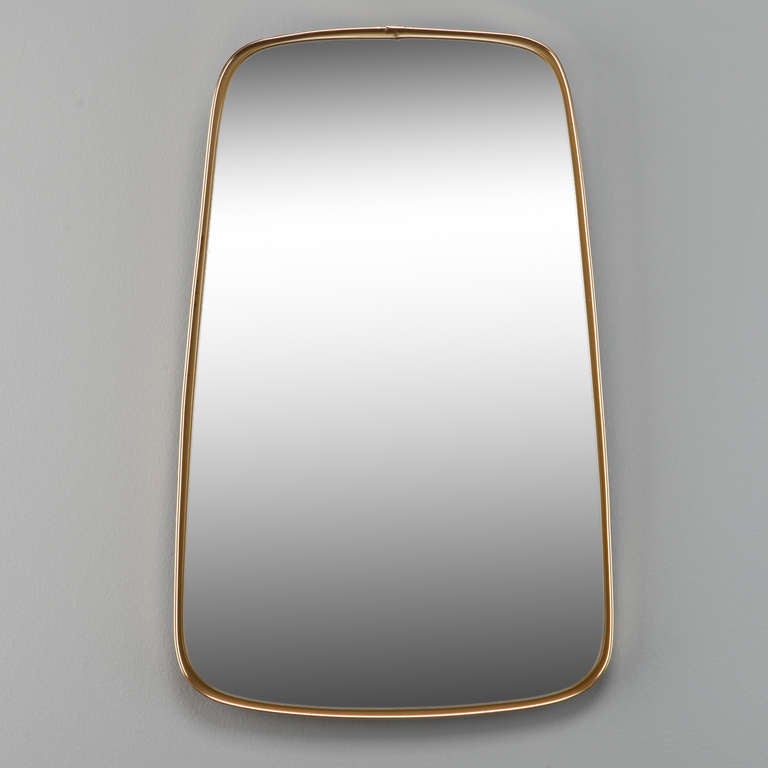 Small circa 1960s rectangular form mirror with minimalist brass frame in the manner of Gio Ponti.
