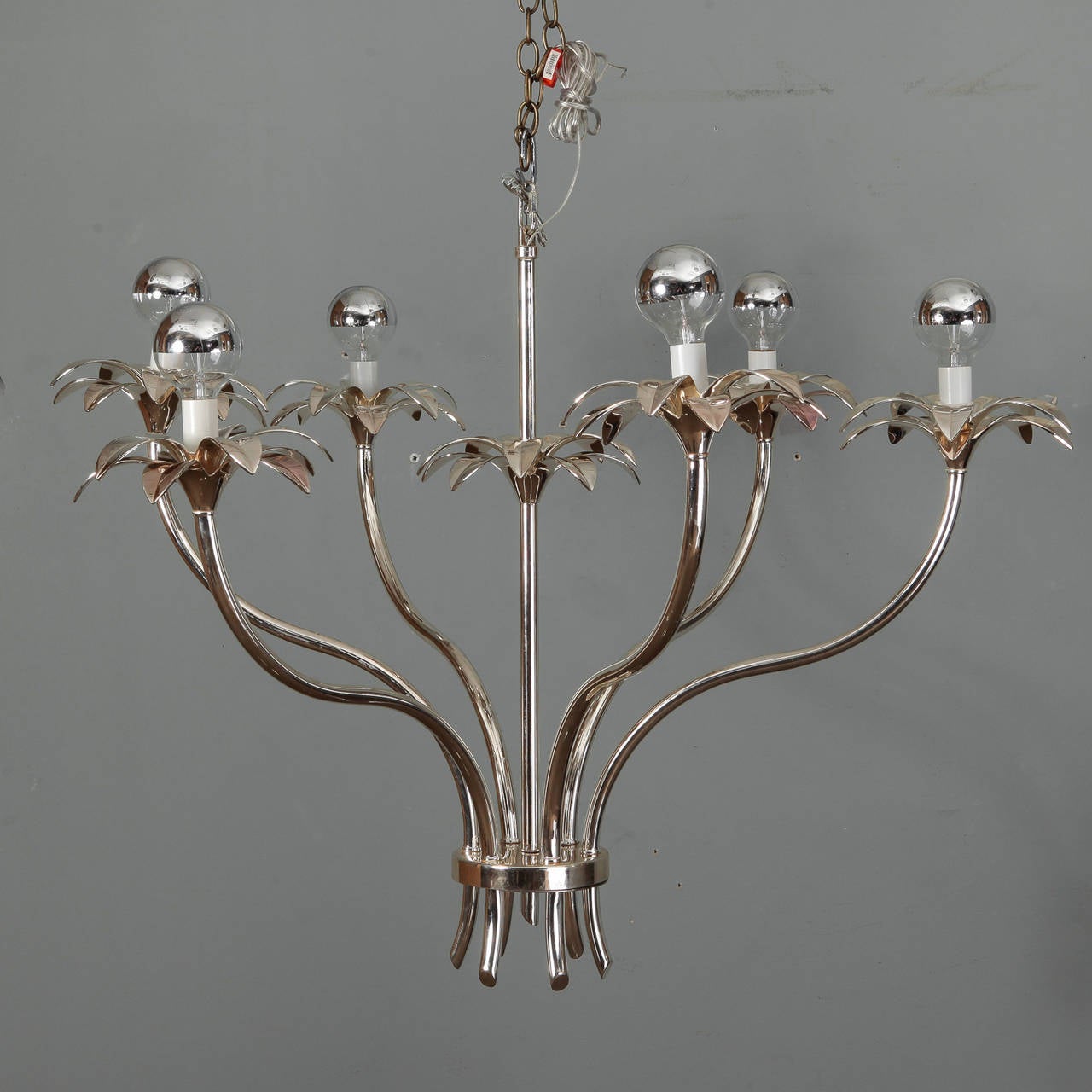 Pair of sculptural, floral and stem form chandeliers have six arms and nickel frames. Found in France, circa 1960s, unknown manufacturer. New wiring for US electrical standards. Sold and priced as a pair.
Number of sockets: Six.
Socket type: