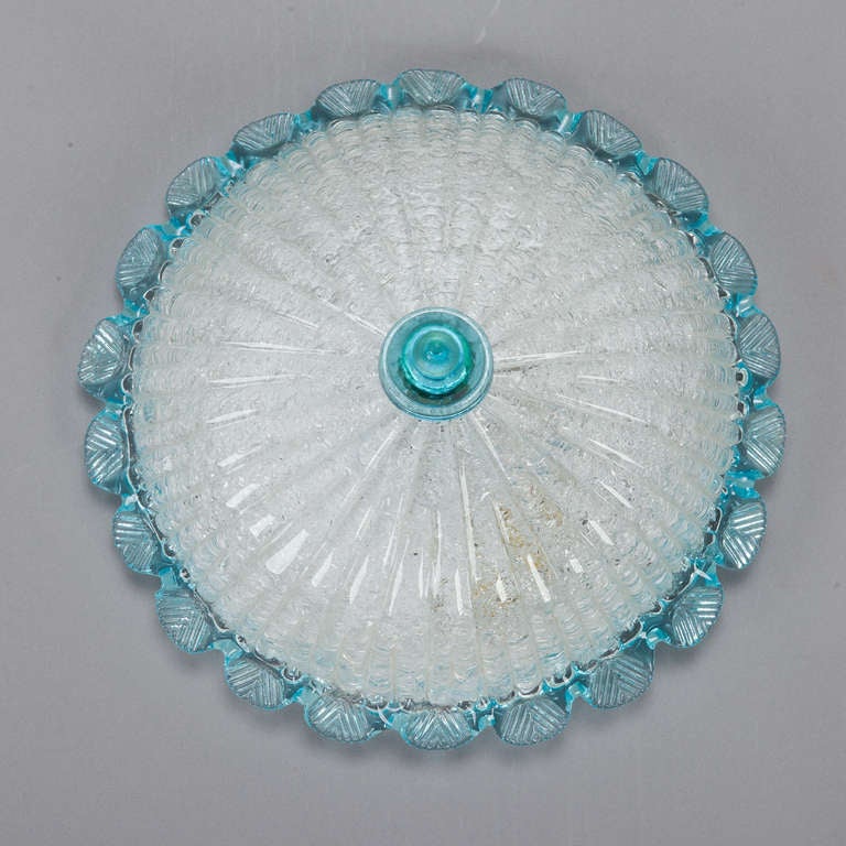 Circa 1960s Murano glass flush mount ceiling fixture has white ribbed globe with clear turquoise blue decorative border and center. New wiring for US electrical standards. 