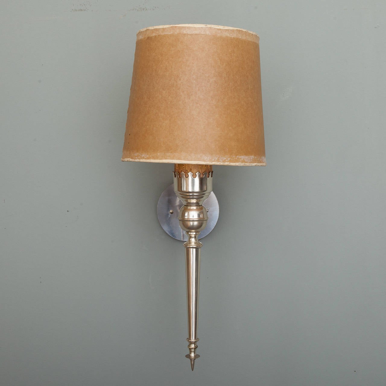 Circa 1940s Italian sconces with neoclassical form, silver tone metal, round back plates and original vintage shades. New wiring for US electrical standards. Sold and priced as a pair. Measurements shown include shade. Several pairs available -