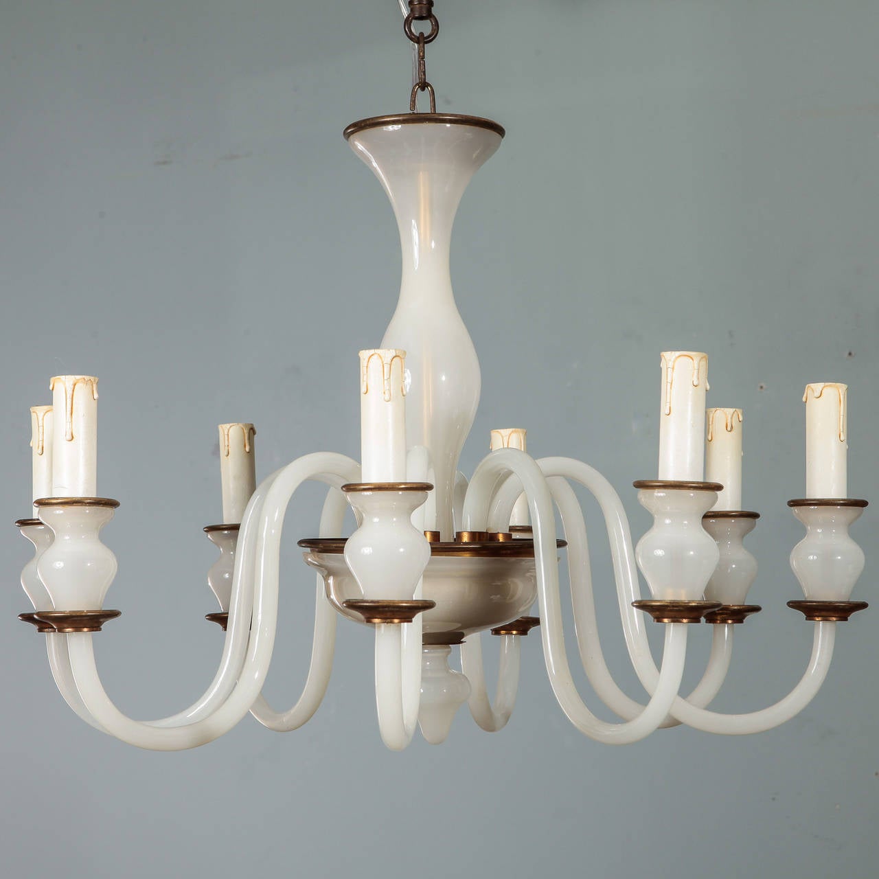 Circa 1960s Murano chandelier in white opaline hand blown glass with brass trim, eight candle arms. New wiring for US electrical standards.