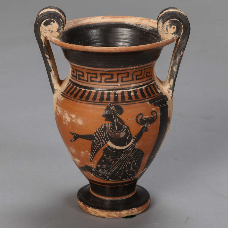 Circa 1890s red ware amphora style urn evocative of Etruscan pottery decorated with classical figures, Greek key border and large, scrolled handles.