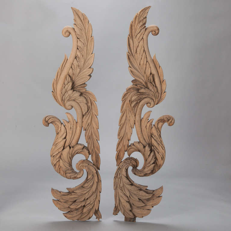 Found in France, this pair of circa 1900 bleached wood large foliate form carved architectural elements are just under five feet tall. These pieces would look great hung on a wall or mounted on stands. Sold and priced as a pair.
 