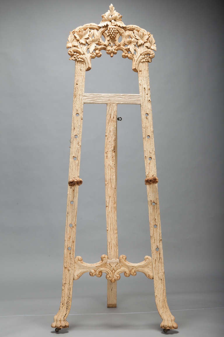 Circa 1900 Black Forest region bleached wood tall easel has beautifully carved details. 
