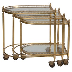 Three Piece Neoclassical Brass and Glass Nesting Tables on Casters