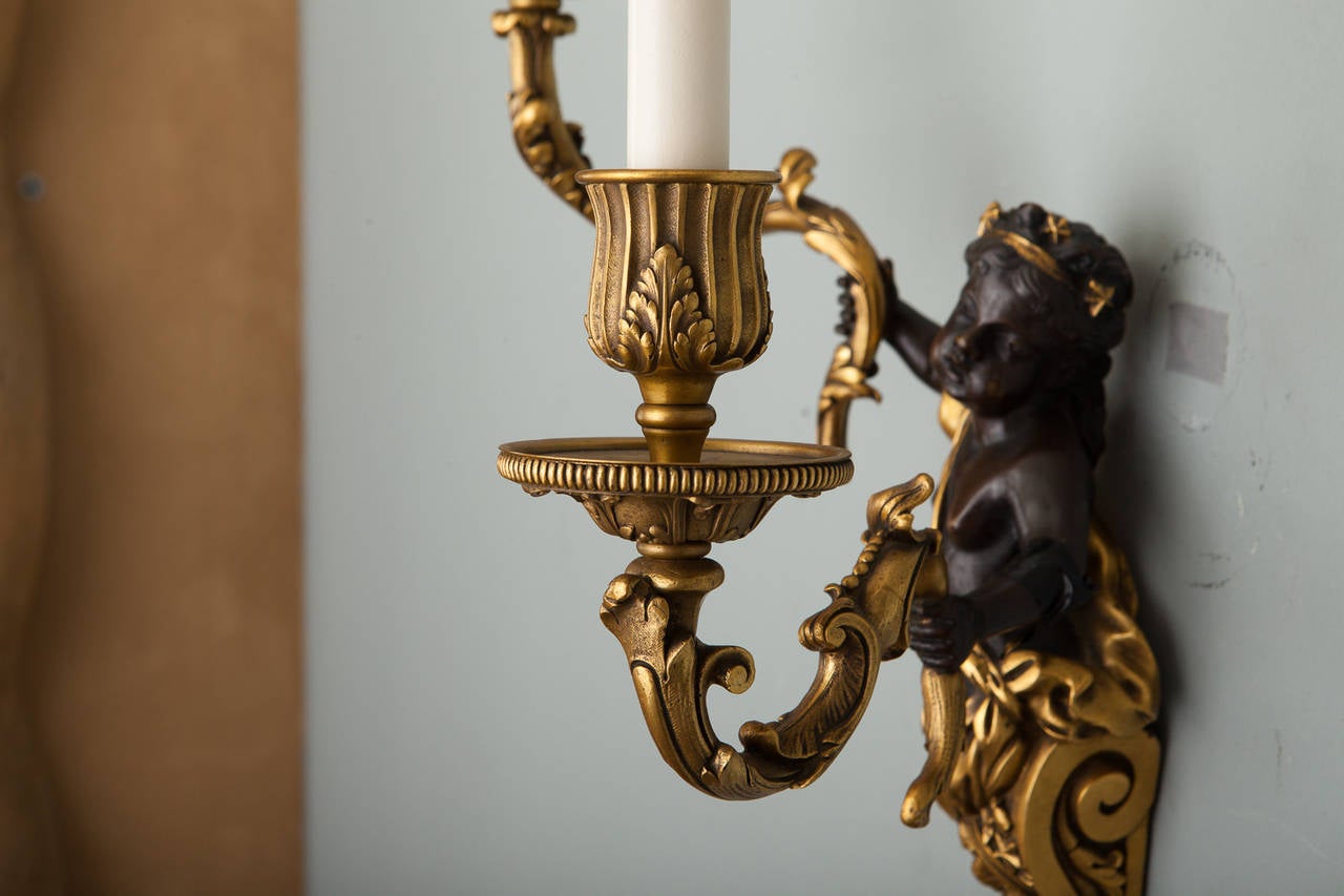 European Pair of Two-Arm Gilded Bronze Sconces with Puti