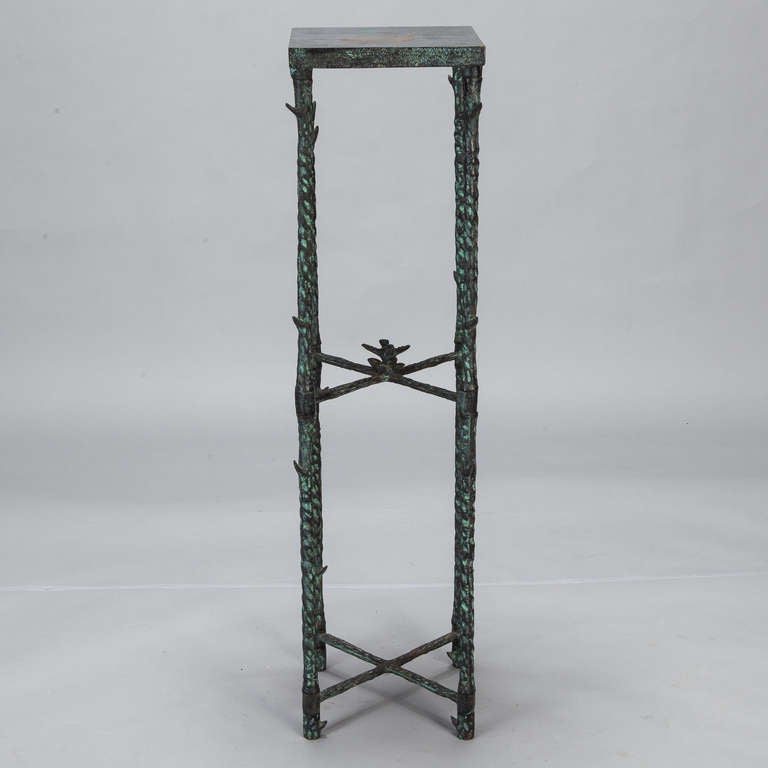 Circa 1960s tall narrow iron plant stand has a green finish and sculpted bird at the center of the top stretchers.