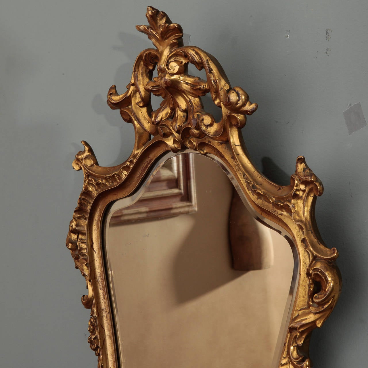 Circa 1920s French mirror with gilded wood and resin frame. Beveled edge mirror.