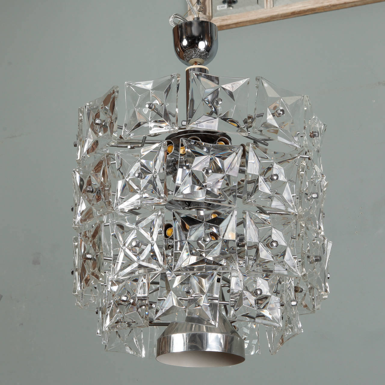 Circa 1960 tall pendant fixture by Austrian manufacturer Kinkeldey with large square shaped crystals. Nickel ceiling canopy and new wiring for US electrical standards.