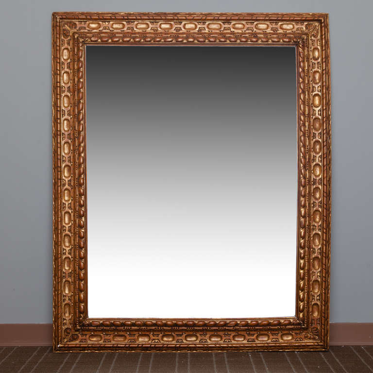 This circa 1900 large rectangular mirror with carved giltwood frame was found in Belgium.  Actual Mirror Size:  44.75” h x 34.75” w