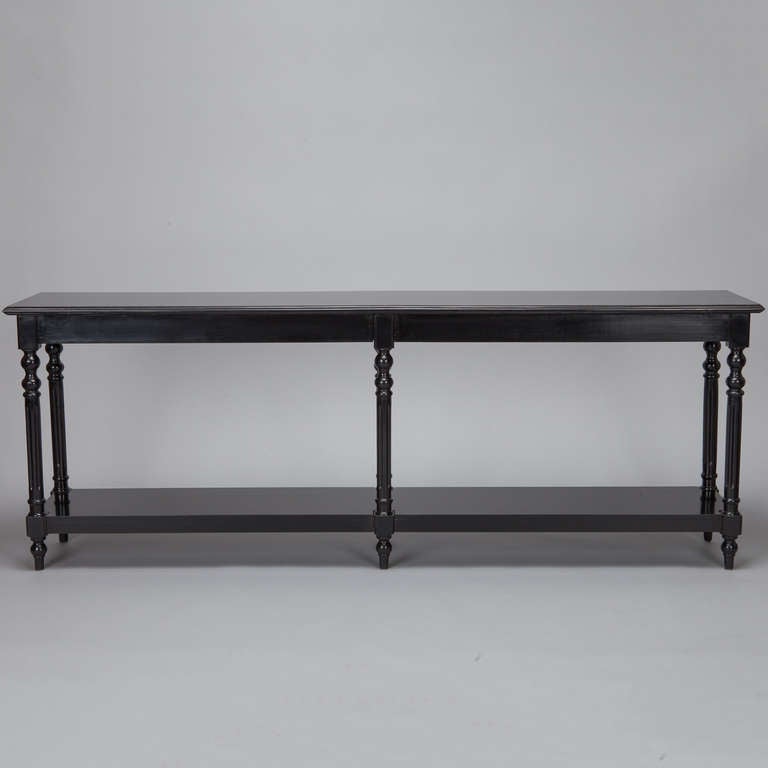 Circa 1900 French console with ebonised finish and six turned legs.