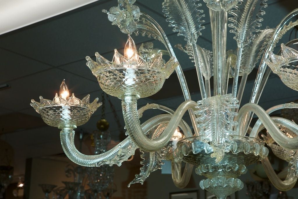 Six light Venetian chandelier has ridged glass arms and beatifully rendered daffodils and leaves.
