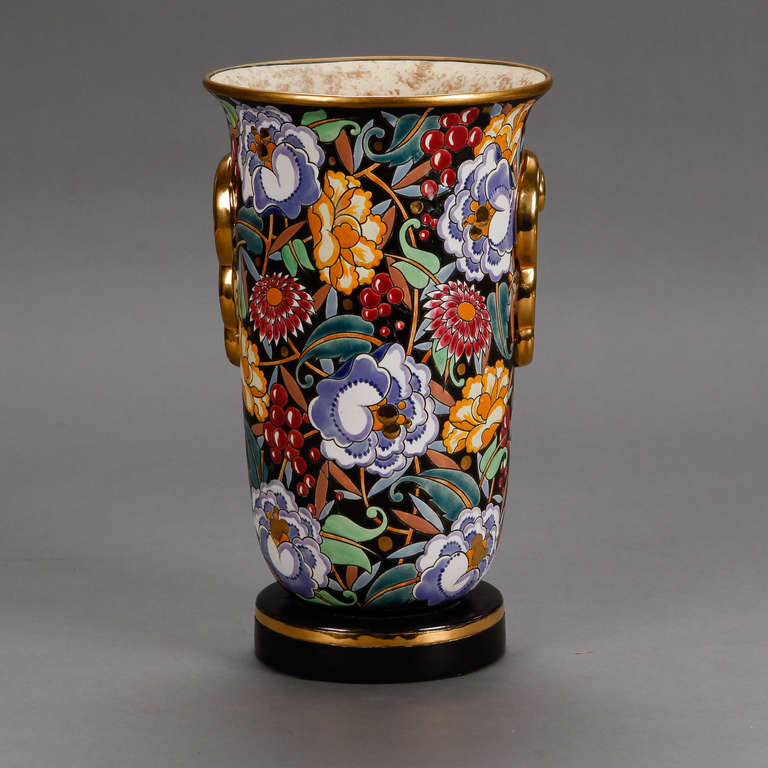 Boch Freres circa 1930s tall vase with vibrant floral glaze and gilt details designed by Raymond Chevalier.
