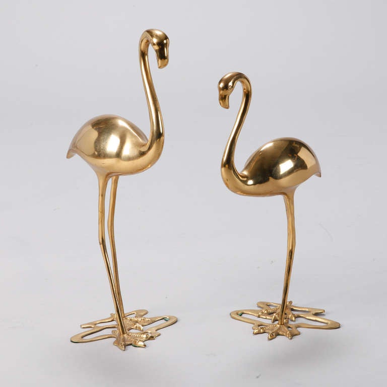 Tall pair of decorative brass free standing flamingo birds. Sold and priced as a pair.