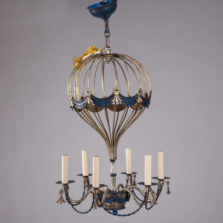 Circa 1960s French metal frame chandelier in the shape of an open work hot air balloon with six candle stye lights and blue details. New wiring for US electrical standards.