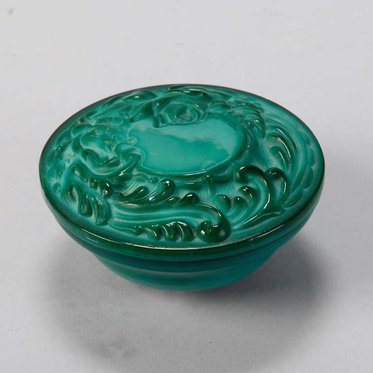 Czech round malachite glass lidded dresser box with a design of vines in relief, circa 1930s.