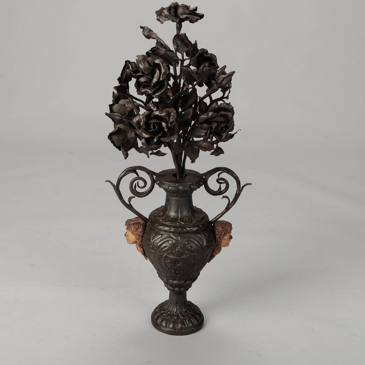 19th Century French Iron Urn with Flowers and Putti Faces In Excellent Condition In Troy, MI