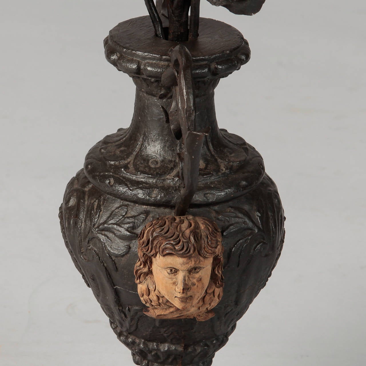 19th Century French Iron Urn with Flowers and Putti Faces 1