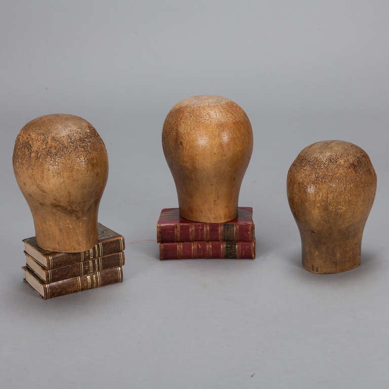 CIrca 1840s English wood heads were originally used to display hats in stores. Several available - sold and priced individually. Size shown is average.