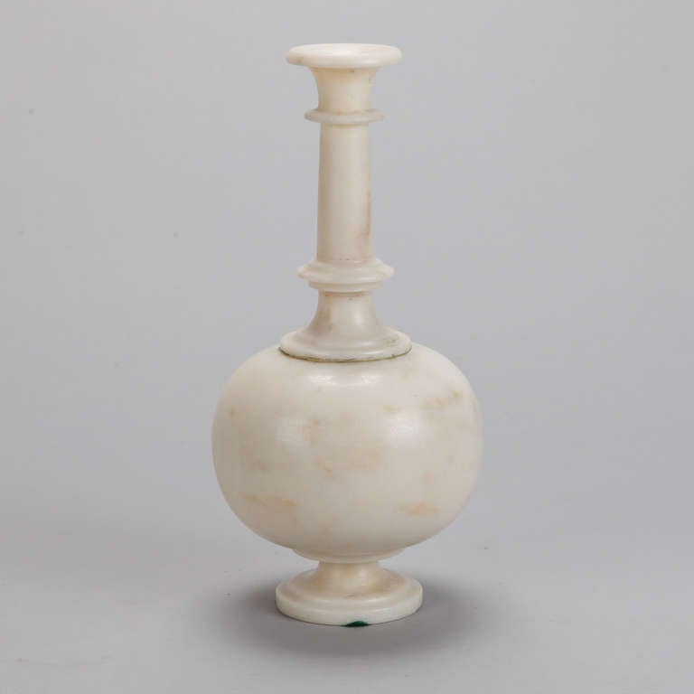Off-white mogul style marble vase or vessel with pedestal base, round body and tall, narrow neck with flared neck, circa 1900.